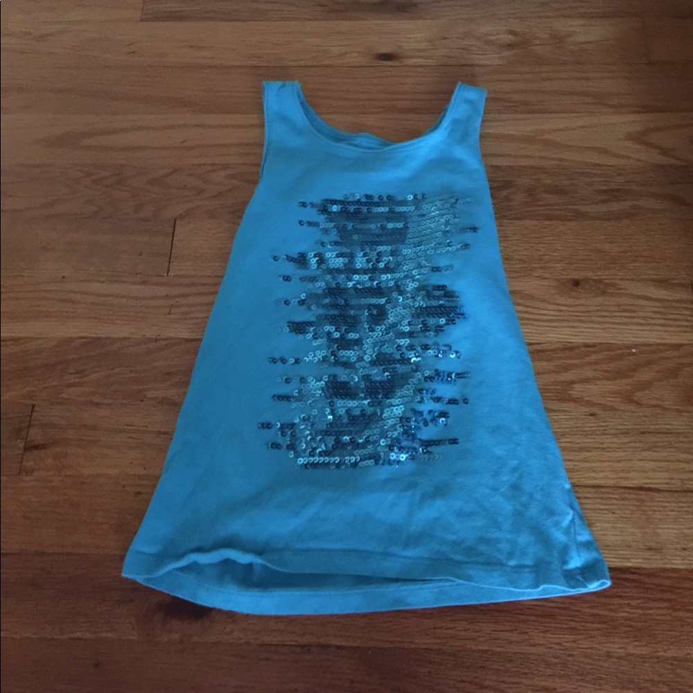 A teal sequined tank top.